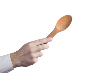 Hand holding wooden spoon isolated on white background with copy space