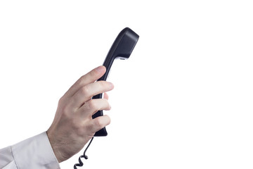 Hand holding telephone isolated on white background with copy space