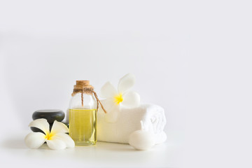 natural oil, soap and flower. Oil aroma from flower, Beautiful Stones spa composition on white background.