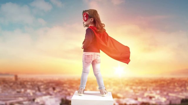 Brave superhero child looking at the landscape