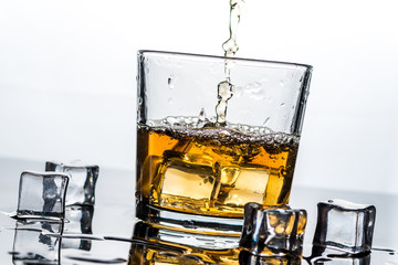 Whisky, whiskey or bourbon with ice