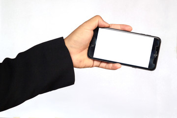 Male hand holding a  smartphone on white background, business concept.