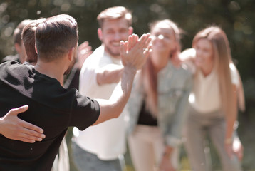 group of friends giving each other a high five