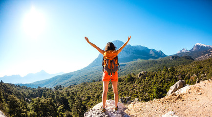 Obraz premium Girl at the top of the mountain.