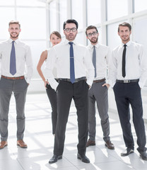 group of young employees standing in the office