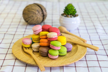 stack of macaron dessert  on woodent plate