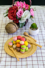 stack of macaron dessert  on woodent plate
