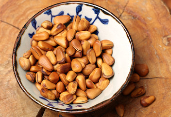Pine nuts on white background