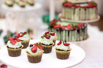 Bride and groom cupcakes with strawberries and chocolate