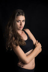 Beautiful woman with healthy body on black background