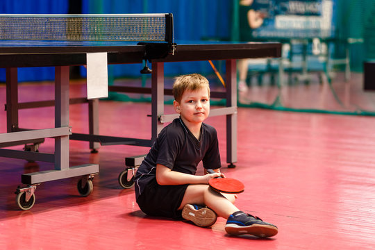 baby sitting on the floor in the gym - Powered by Adobe