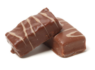 Chocolate peanut candy on white background