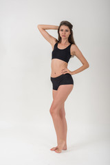 Obraz premium Beautiful woman with healthy body on white background