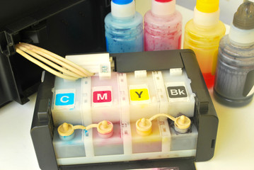 Four color printer on white background.