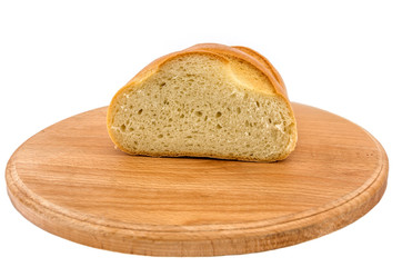 long loaf on a wooden board on a white background