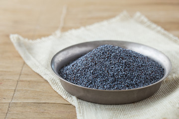 Dried poppy heads and seeds. Blue poppy in bowl