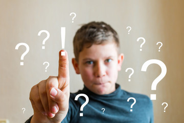 teen boy shows his finger at an imaginary screen