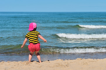 Small kid play with sand