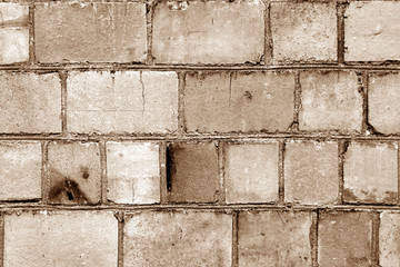 Old grungy brick wall surface in brown color.