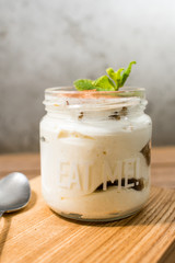 panakota in a jar on a kitchen board with a spoon