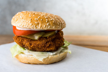 chicken burger on wooden table gray background
