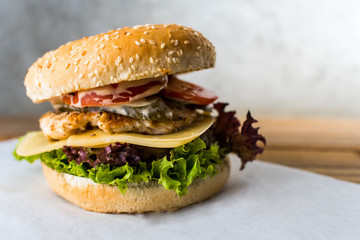 double decker burger on wooden table gray background