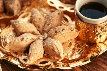 Turkish sweets with coffee on a wooden table