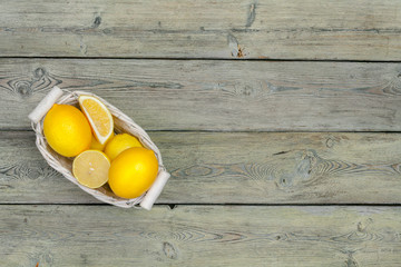 fresh lemons on wooden table.