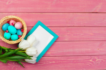 Easter background with tulips, eggs . Top view with copy space