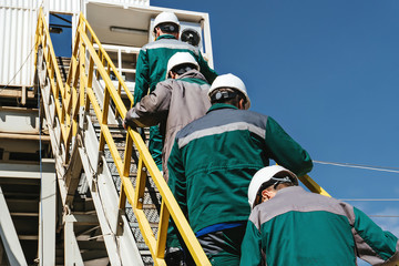 workers go to the oil rig