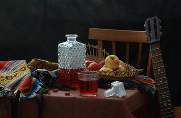 Red wine with fruit on a white tablecloth