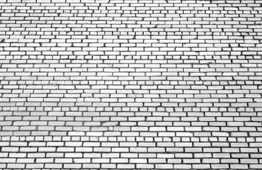 Pattern of brick wall with blur effect in black and white.