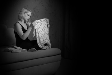 postpartum women's depression. the cleaning in the house. upset woman. wash diapers. 