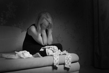 postpartum women's depression. the cleaning in the house. upset woman. wash diapers. 