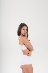 Fototapeta premium Beautiful woman with healthy body on white background