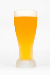 Glass of classic lager beer isolated on white background.