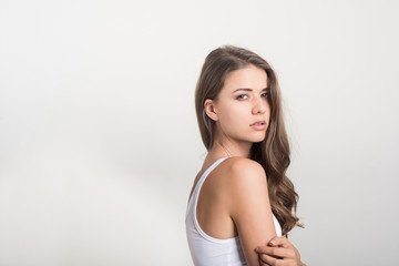 Fototapeta premium Beautiful woman with healthy body on white background