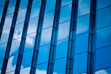 Clouds Reflected in Windows of Modern Office Building.