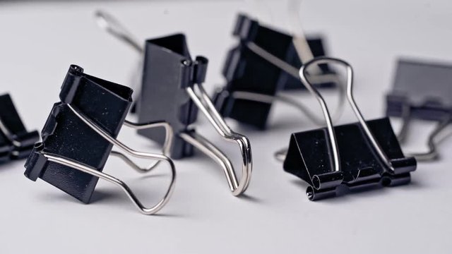 Pile of metal binder clips. Office supplies