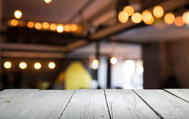 blurred background of bar and dark brown desk space of retro wood