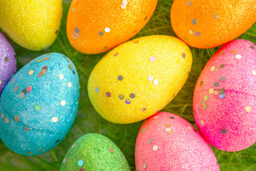 Fototapeta na wymiar colorful easter eggs on green background