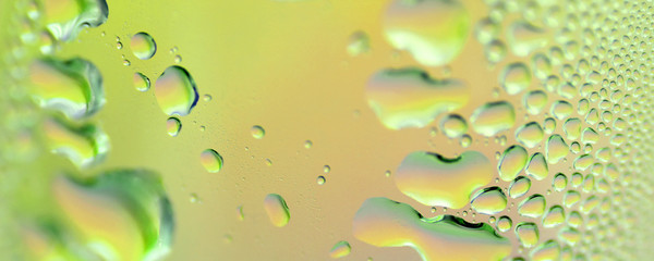 water drops on misted glass green macro