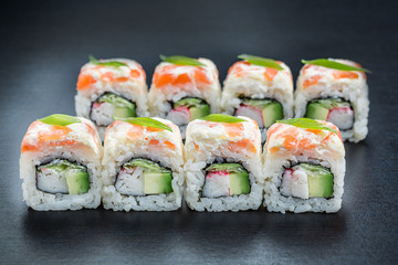 Japanese cuisine. Sushi on dark background