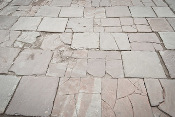 Paving the street in the city. Replacement of old paving tiles. Repairs. Chernivtsi, Ukraine, Europe, March 2019.