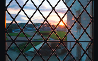 Sunset view behind vintage window