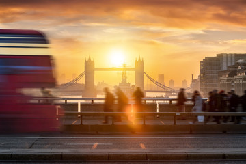 Silhouettes of traffic and people going to work during the early morning rush hour in London, UK,...