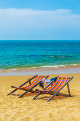 Fototapeta na wymiar Deck chairs at the beach