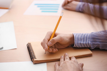 Woman sitting at table during business meeting © Pixel-Shot