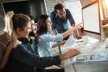 Young architects working on project in office