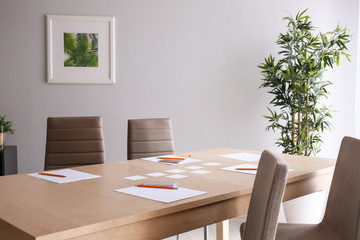 Table with stationery prepared for business meeting in conference hall